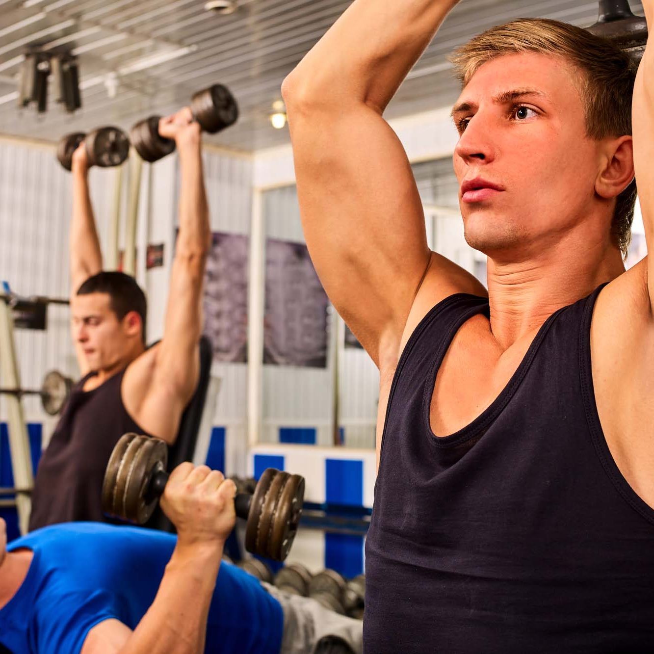 men lifting weights